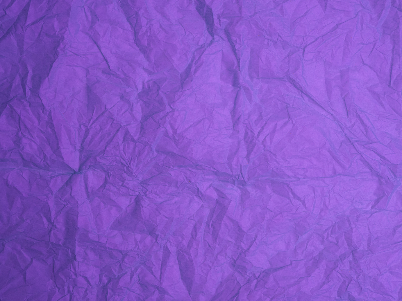 Crumpled paper texture for background. Purple paper.